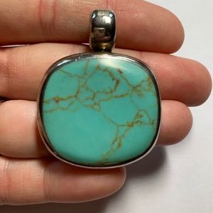 Turquoise and silver pendant